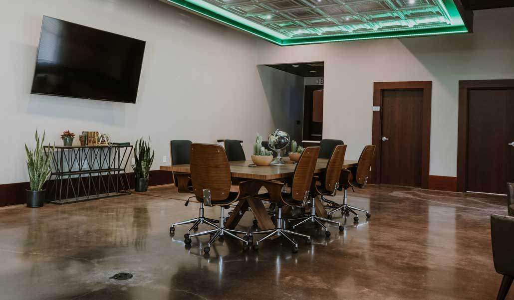 A Heritage meeting room with polished concrete floors and exposed brick in Venus, Texas